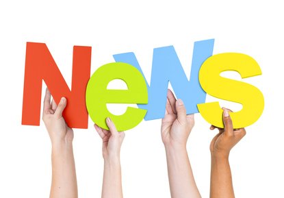 Multi Ethnic People Holding The Word News